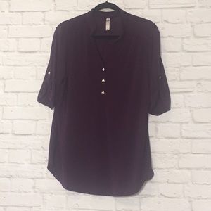 Plum blouse with half sleeve.